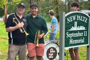   Band student with Band director at 9/11 ceremony